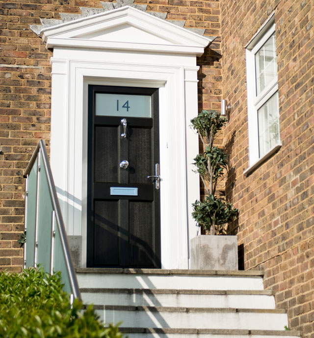 black front door with etched glass